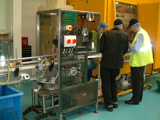 Service and Maintenance Two men providing maintenance to a conveyor system